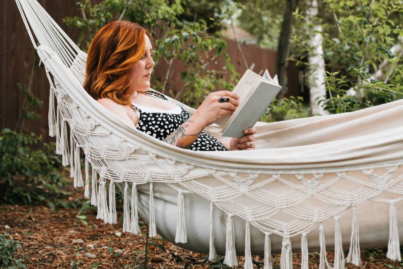 woman reading on a hammock